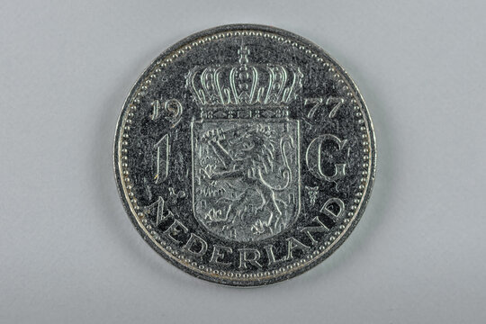 Front side of a former 1 guilder coin from the Netherlands
