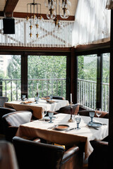 A beautifully laid table with exquisite dishes in a modern restaurant.