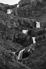 Picturesque, cascading Klifbrekkufossar waterfall in Mj&oacute;ifj&ouml;r&eth;ur, East Fjords, Iceland