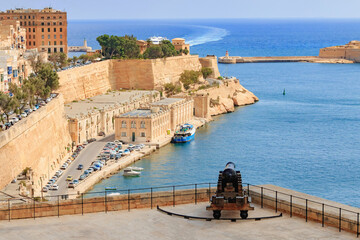 Valletta port gates and old historical canon - Malta