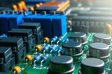 Closeup of Printed Circuit Board with  integrated circuits and many other passive electrical...