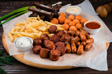 snacks for beer with different sauces on parchment