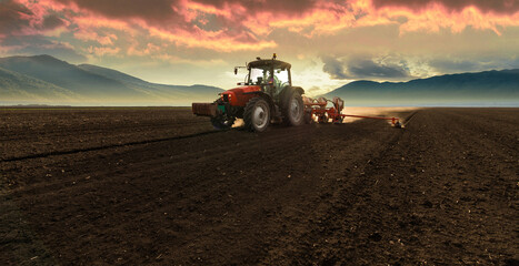Farmer with tractor seeding © Dusan Kostic