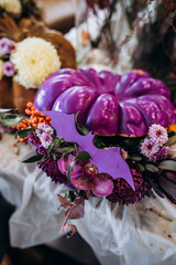 Pumpkin decoration with fresh flowers