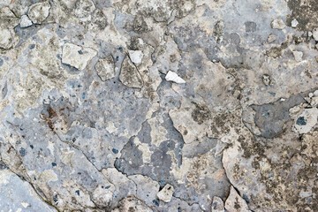 Cracked concrete texture closeup background.