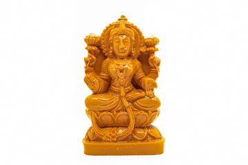 Fototapeta na wymiar The statue of Mahalakshmi carved in wood is isolated in white