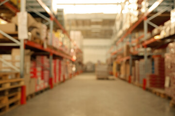 Warehouse with lots of products, blurred view. Wholesale business