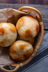 Hot cross buns on basket Top view, copy space. Easter baking