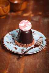 Decorated chocolate cake. Glazed and tasty dessert, great for celebration. Dark wooden background
