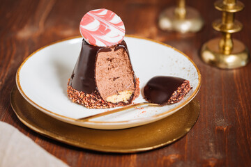 Decorated chocolate cake. Glazed and tasty dessert, great for celebration. Dark wooden background