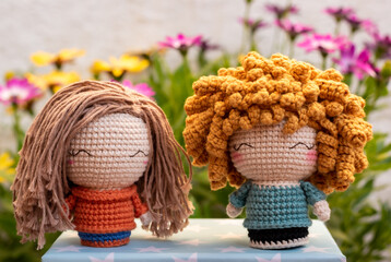 crochet girl handmade dolls with a flower background