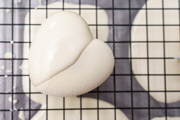 white mousse cake on grill close-up