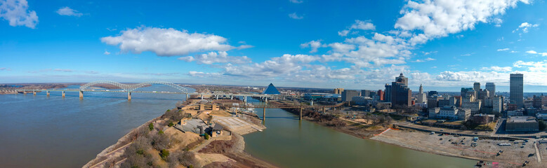 an aerial panoramic shot of Wolf Creek Harbor and the Mississippi river with skyscrapers and...