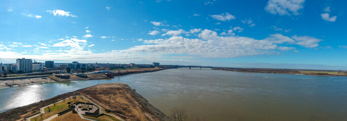 a stunning aerial panoramic shot of the vast flowing waters of the Mississippi river and Wolf Creek...