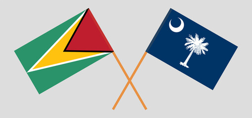 Crossed flags of Guyana and The State of South Carolina. Official colors. Correct proportion