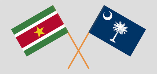 Crossed flags of Suriname and The State of South Carolina. Official colors. Correct proportion