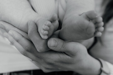 baby feets in parents hands