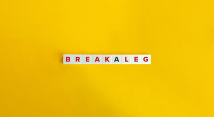 Break a Leg Idiom. Letter tiles on bright orange background. Minimal aesthetics.