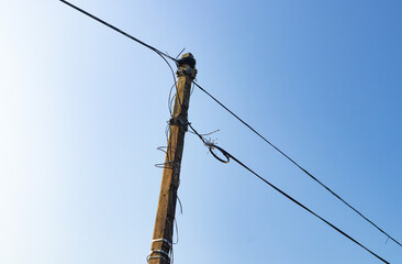 Low angle shot of an Electric pole with wires