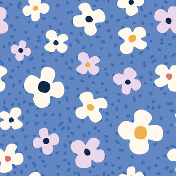 Seamless pattern with abstract flowers on a blue background in random order