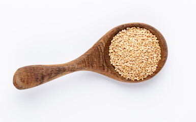 Bio natural sesame seeds on wooden bowl.
