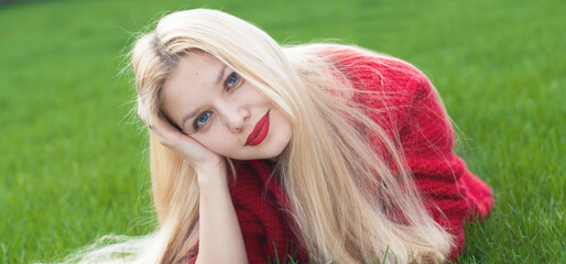Beautiful model girl applying red lipstick on her lips - bright make up - 486974193
