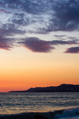 Fototapeta premium Amazing sea sunset, the sun, waves, clouds