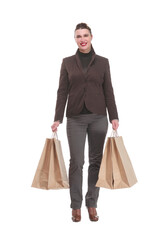 Happy young woman with shopping bags on white background