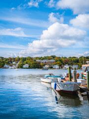 Fototapeta na wymiar Seascape with moored boats at the Mystic River, Connecticut