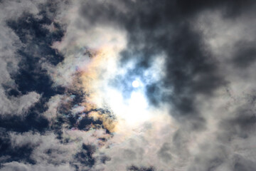 a shot of a powerful clouds and blue sky with the sun peeking through the clouds at Martin Luther...