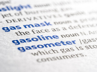 Gasoline - English dictionary definition of the word - photo of a dictionary page with paper grain texture - selective focus on the word