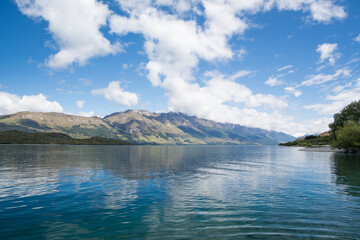 Mountains and sky reflecting in Lake Wakatipu, New Zealand