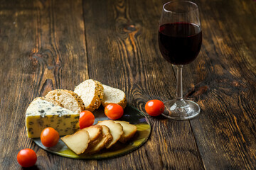 cheese, bread and a glass of wine