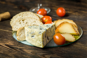 cheese, bread and a glass of wine
