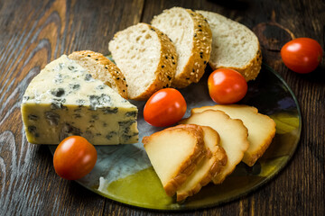 cheese, bread and a glass of wine