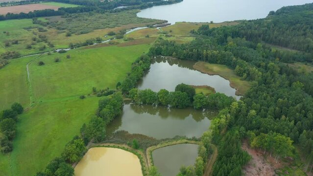 Trebonsko biosphere UNESCO reserve protected landscape area wetlands pond Rozmberk fishpond system fish hatchery cages fishing Czech largest biggest meadows Trebon, drone aerial video shot ecosystem