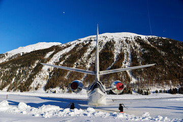 Rear view of a private corporate jet in the airport of Engadine St Moritz