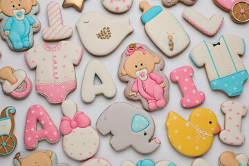 Set of baby shower cookies on light background, flat lay