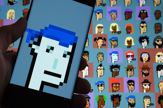 NFT Cryptopunk 5822 seen on the screen of smartphone and blurred background with other charachters form Cryptopunks collection. Stafford, United Kingdom, February 13, 2021.
