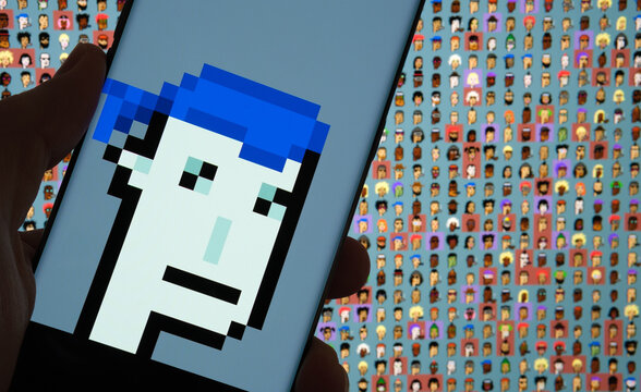 NFT Cryptopunk 5822 seen on the screen of smartphone and blurred background with other charachters form Cryptopunks collection. Stafford, United Kingdom, February 13, 2021.