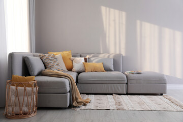 Living room interior with large grey sofa