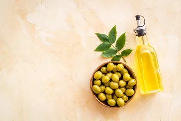 Foto op Plexiglas Bottle of olive cooking oil with green olives in bowl © 9dreamstudio
