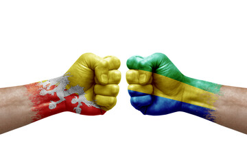 Two hands punch to each others on white background. Country flags painted fists, conflict crisis...