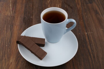 Chocolate Wafer on Wooden Plate, Served with Tea, Copy Space