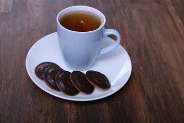 Image of ivory tea cup with sweet heart shaped cookie