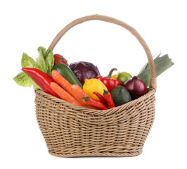 Fresh ripe vegetables and fruits in wicker basket on white background