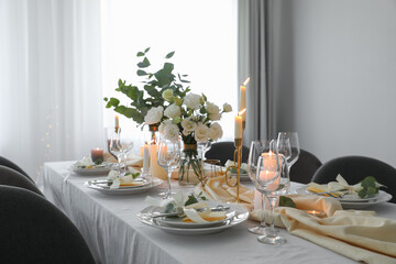 Festive table setting with beautiful floral decor in restaurant