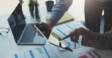 Fund managers team consultation and discuss about analysis Investment stock market by digital tablet.