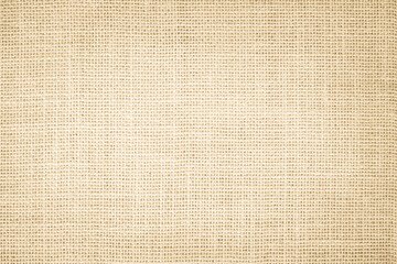 Fototapeta na wymiar Jute hessian sackcloth burlap canvas woven texture background pattern in light beige cream brown color blank. Natural weaving fiber linen and cotton cloth 