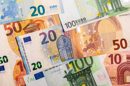 Euro currency banknote background. Close-up of Euro paper money in cash. Different banknotes in European currency on the table. Background from paper money.